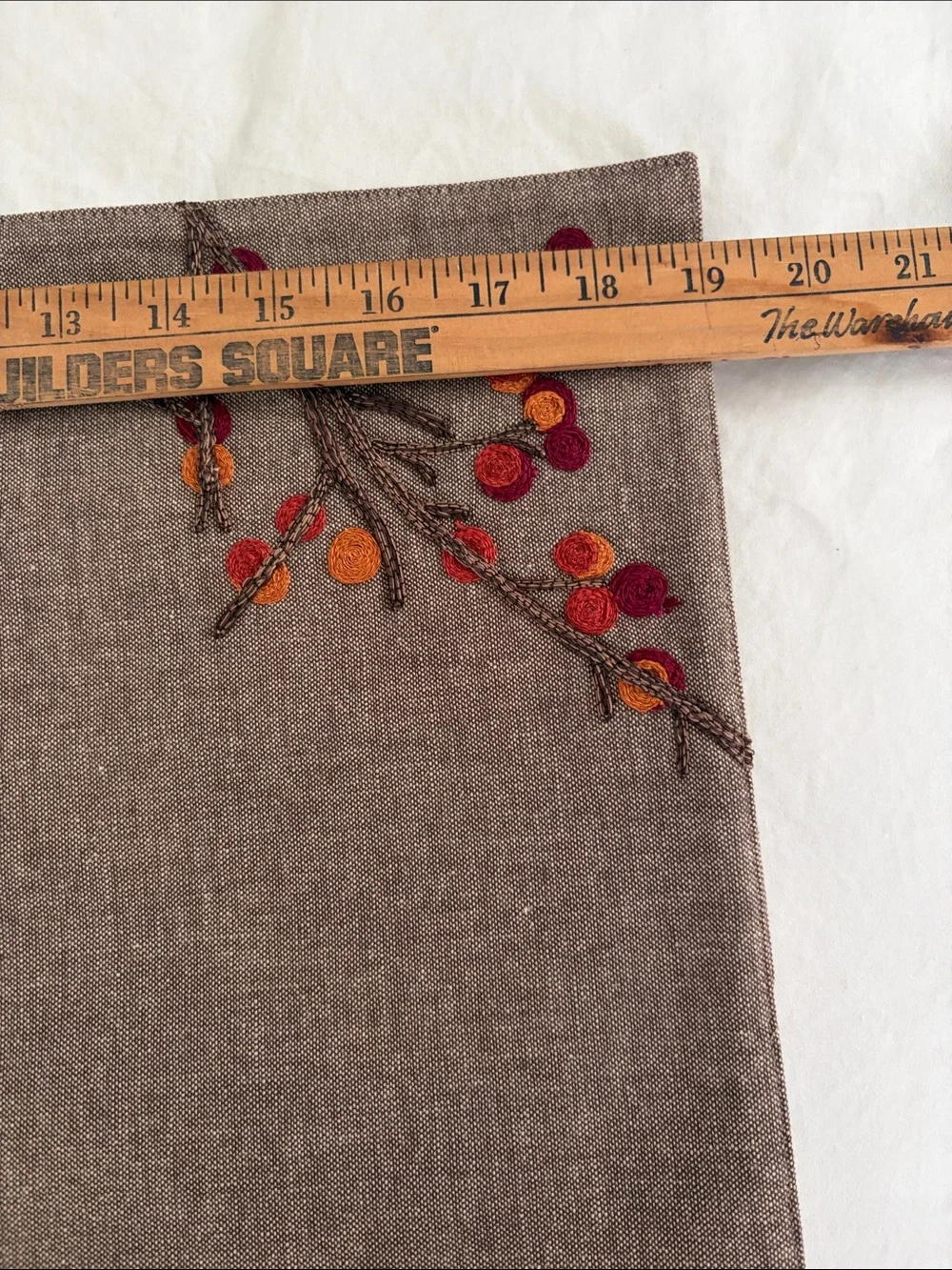 Crate&Barrel Embroidered Placemats with Shades of oranges and reds.